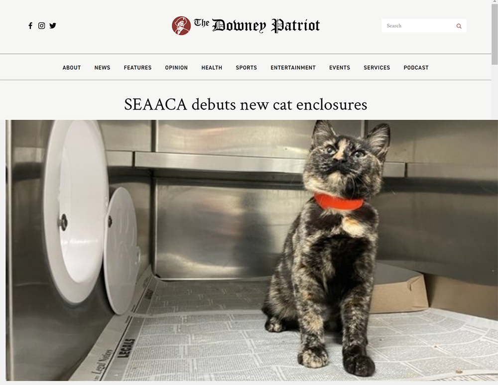 Image of newspaper headline, 'SEACCA debuts new cat enclosures'