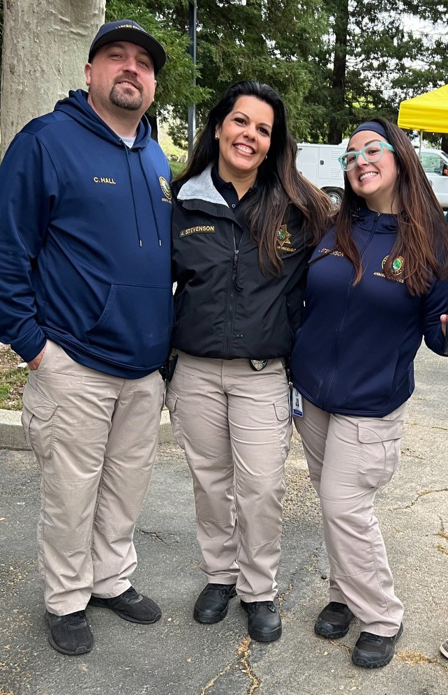 The Rancho Cordova Animal Services team leans in for a group photo: left to right, Craig Hall, Kristy Acuna, and April Stevenson.