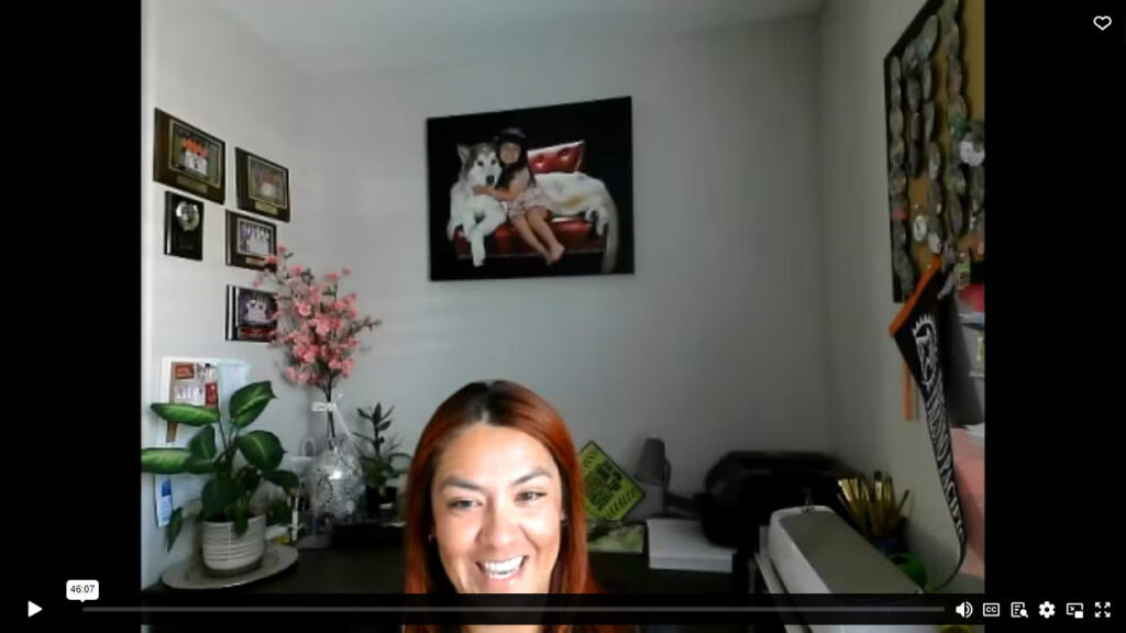 Ivy Ruiz smiling as she talks in a Zoom from her home office.