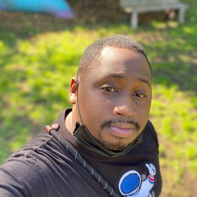 Selfie of Donnell wearing a black shirt with an astronaut on it.